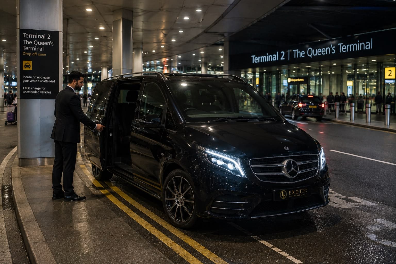 A chauffeur waiting with a black Mercedes V-Class at the Heathrow Terminal 2 drop-off